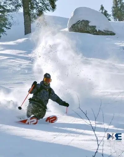 Skier carving through fresh powder in Gulmarg