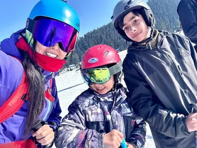 Happy family enjoying ski lessons in Gulmarg